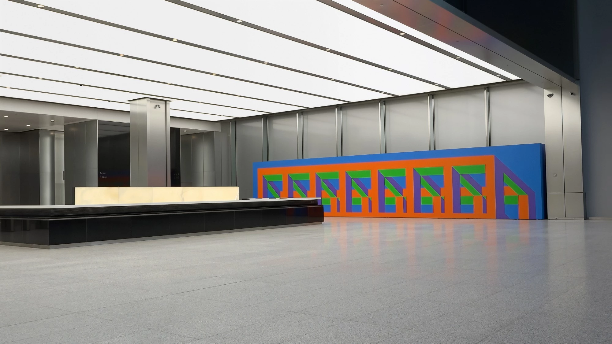 Lobby of 3 World Trade Center in New York with a large colourful image wall on Mila-wall modules